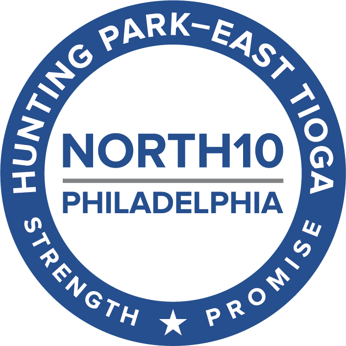 the North10 logo says "NORTH10 Philadelphia" in the center in blue capital letters, with the words separated by a gray horizontal line.  That is surrounded by a blue ring with white text that says "Hunting Park - East Tioga" around the top half, and "strength" and "promise" around the bottom, separated by a star.