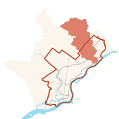 a minimalist map showing Philadelphia outlined in orange, and the Pennypack Watershed shaded in orange across the western side of Northeast Philadelphia, and extending north of the city.