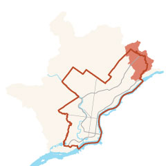 a minimalist map showing Philadelphia outlined in orange, and the Poquessing Creek Watershed shaded in orange across the upper northeast section of Philadelphia, extending slightly north of the city boundary.
