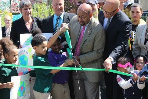 Mayor Nutter and Dr. Hite join George W. Nebinger students in a ribbon cutting for their green schoolyard on Earth Day 2015.