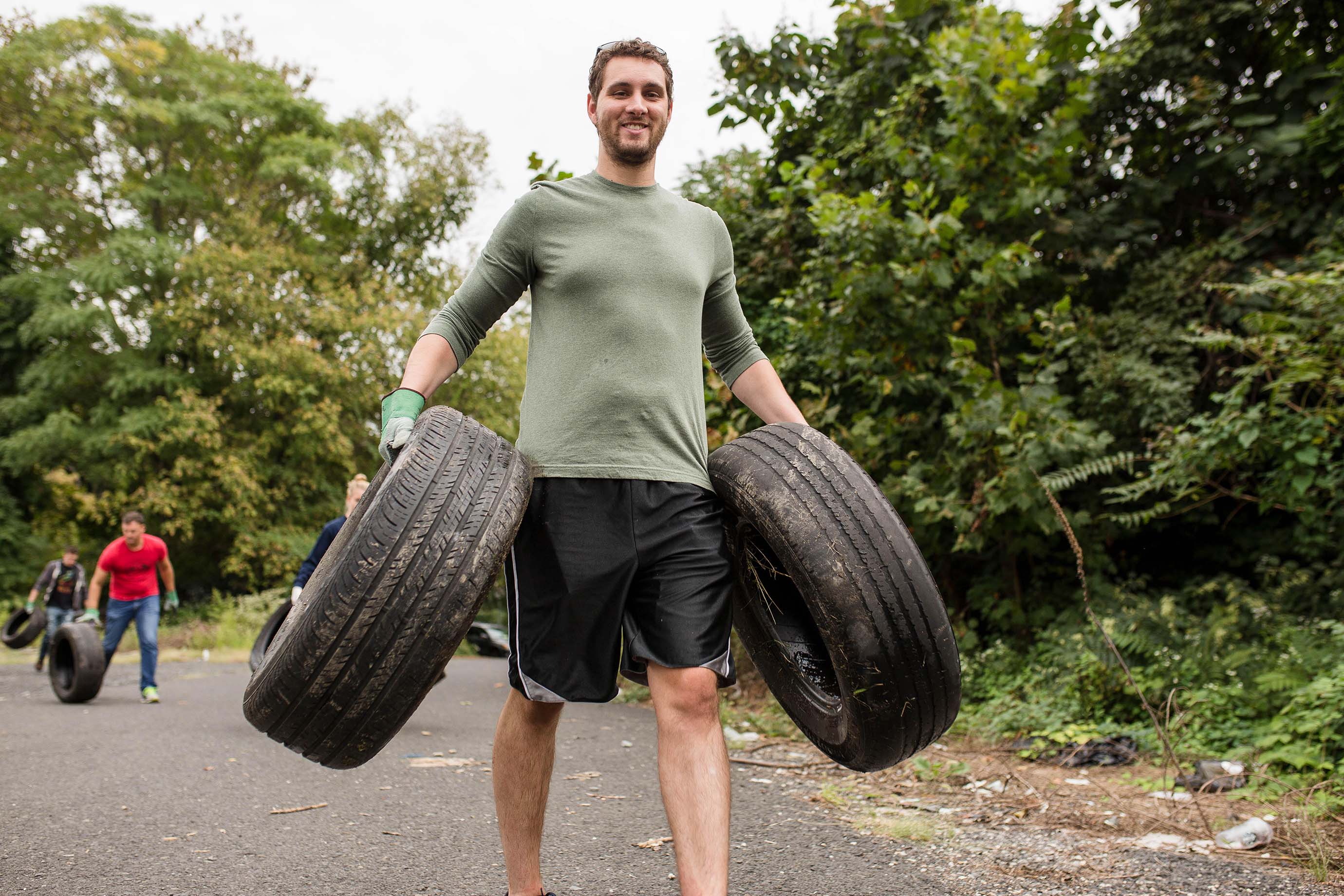 Tires are collected by volunteer at the Falls Road site in Fairmount Park. 