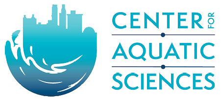 Center for Aquatic Sciences logo features the name stacked, one word per line except "for" tucked in vertically on the first, next to a mark resembling a city skyline on top swooshing into a wave with a fish leaping out of it, in a gradient from teal at the top to a deep blue at the bottom.