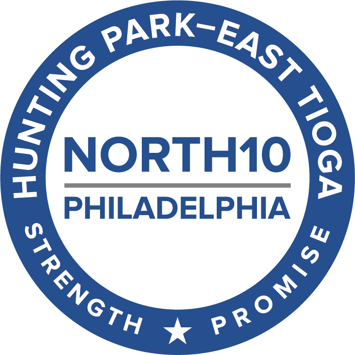 the North10 logo says "NORTH10 Philadelphia" in the center in blue capital letters, with the words separated by a gray horizontal line. That is surrounded by a blue ring with white text that says "Hunting Park - East Tioga" around the top half, and "strength" and "promise" around the bottom, separated by a star.