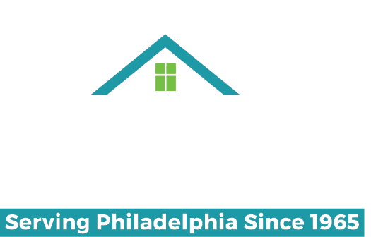 Philadelphia Housing Development Corporation logo says PHDC in large letters, with a peaked roof over the H and D, with three tall city buildings peaking above the roof. Below, it says "Serving Philadelphia Since 1965"