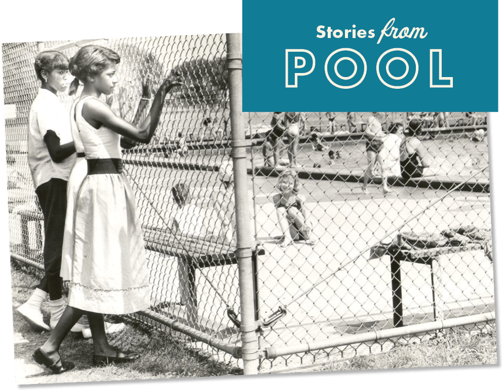 A teal label reading "Stories from POOL" in playful fonts overlays the top right corner of a black and white photograph showing two African American girls, one in a white sleeveless dress with a dark belt and dark flats, the other in a light colored short sleeved top, dark pants, and white socks and sneakers, standing outside the chain link fence surrounding a swimming pool, fingers entwined in the fence as the nearer (Mamie Livingston) looks inside, and the other looks at her. Inside the fence, white people are visible in and around the pool, and a young girl with light skin and chin length, light hair sits on the ground in a small group smiling at the camera.