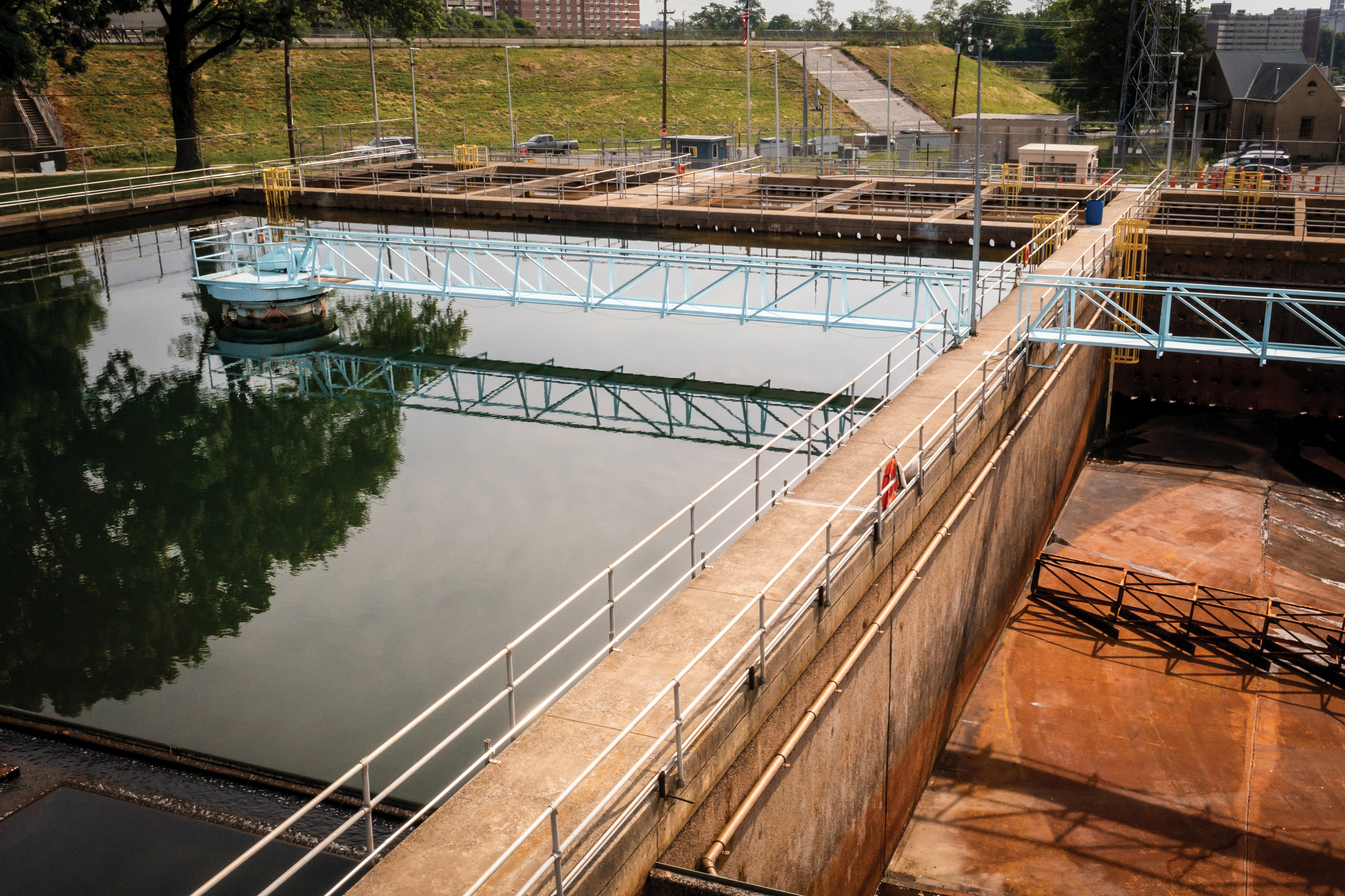 An aerial view of one of PWD's drinking water treatment plants, with walkways criss-crossing over large tanks of water beginning its journey from our rivers to your tap.