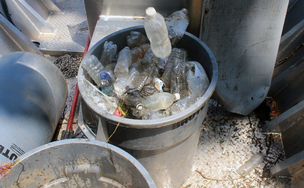 One of six 55-gallon trash cans of litter pulled from the Schuylkill River during the maiden voyage of Philadelphia Water’s new workboat. Credit: Brian Rademaekers